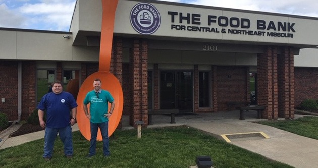 Accident Fund team members standing in front of community food bank in Missouri.